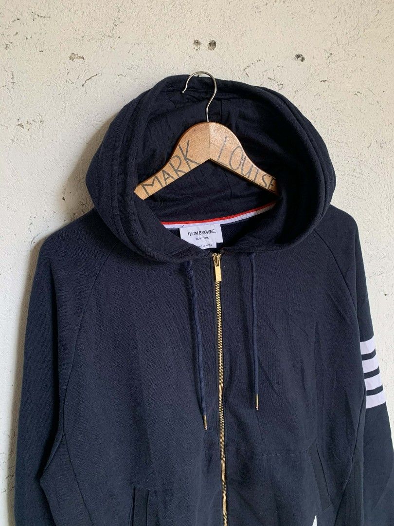 Thom browne engineered 4-bar zip up drawstring hoodie (Category: Luxury Apparel) located in Manila. Submitted by louiseluch69680 (Listing ID 1425859129, Image 2). Description: ✅ (Authentic) Thom browne engineered 4-bar zip up drawstring hoodie, made in Japan. SRP: 50k+ or almost $1000 I'm only selling this for ₱12,500 or best offer💵 almost brand new condition 10/10 Color rate Size 4 on tag actual measurement - width: 23.5 - length: 28 .