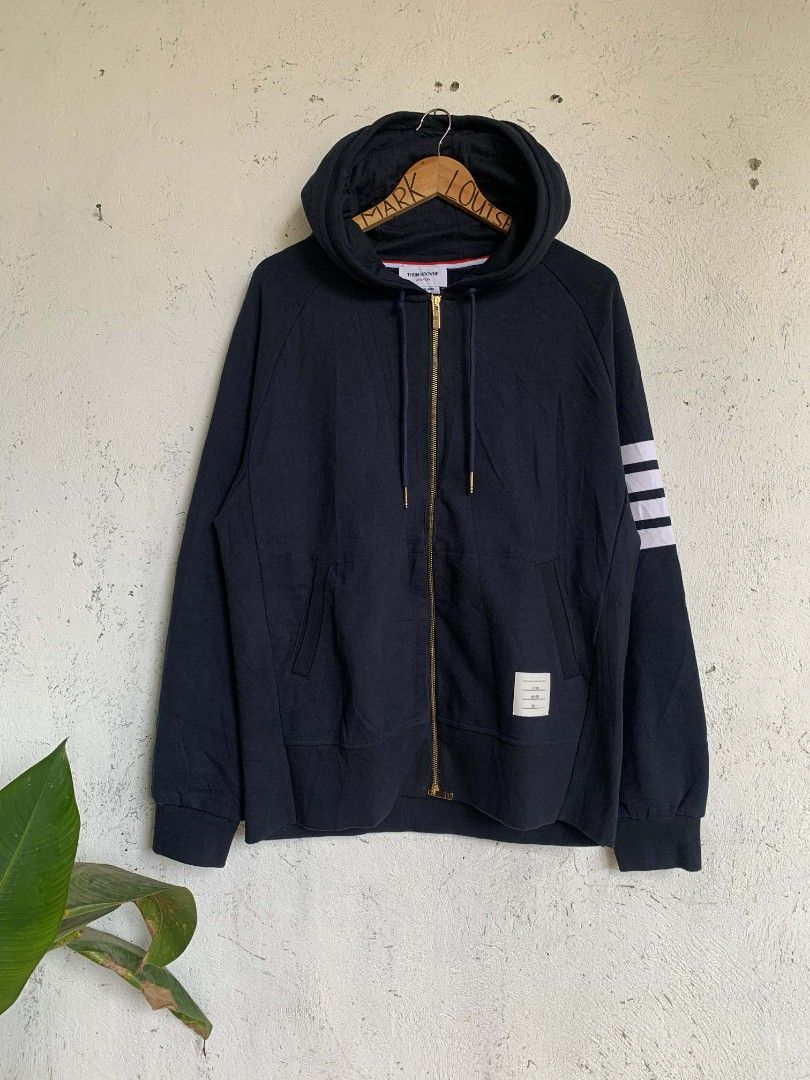 Thom browne engineered 4-bar zip up drawstring hoodie (Category: Luxury Apparel) located in Manila. Submitted by louiseluch69680 (Listing ID 1425859129, Image 1). Description: ✅ (Authentic) Thom browne engineered 4-bar zip up drawstring hoodie, made in Japan. SRP: 50k+ or almost $1000 I'm only selling this for ₱12,500 or best offer💵 almost brand new condition 10/10 Color rate Size 4 on tag actual measurement - width: 23.5 - length: 28 .