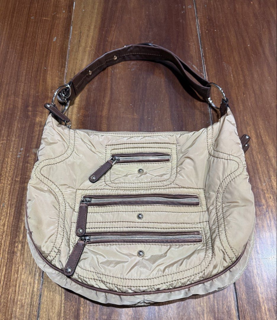 Tod's Luna Nylon Media Bag (Category: Luxury Bags & Wallets) located in Quezon City. Submitted by enidee (Listing ID 1425948467, Image 1). Description: -lightweight, nylon body with leather trims - multiple exterior zippered pockets -shoulder or crossbody bag -adjustable strap -wrap-around zipper to expand the bag’s capacity. -light discoloration on sides Please see photos for actual condition of the bag.