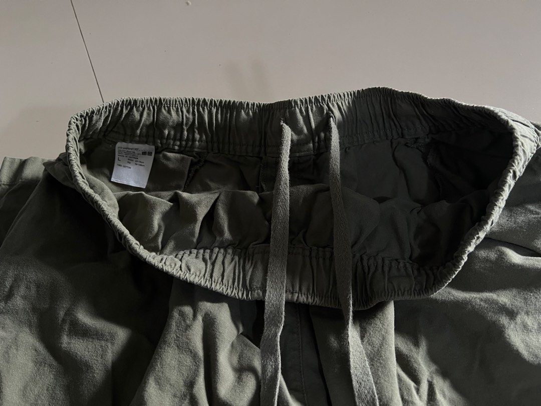 Uniqlo Drawstring Garterized Trousers (Category: Other Bottoms) located in Malay. Submitted by spacetrips (Listing ID 1425910349, Image 3). Description: Price: ₱300 (Last price) Shipping: ₱60 Details: • Brand: Uniqlo • Size: Large (Fits 69–75cm waist per tag) • Color: Dark Olive / Charcoal Green • Measurement: ~14” across waist (laid flat, stretchable) • Features: Full gartered waistband with adjustable drawstring, deep side pockets, and a clean 