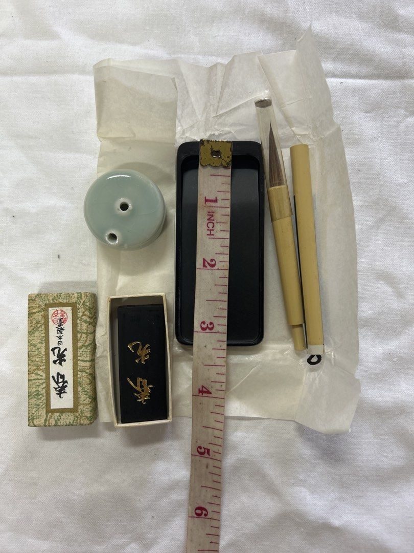 Vintage Calligraphy Set with Ink and Brush (Category: Craft Supplies & Tools) located in Bulacan. Submitted by ourdailybreads (Listing ID 1425844992, Image 2). Description: Calligraphy set includes an ink stone, ink stick, two brushes, and a ceramic water dropper. The ink stone is black, and the brushes have bamboo handles. The set also comes with a small box containing an ink stick..