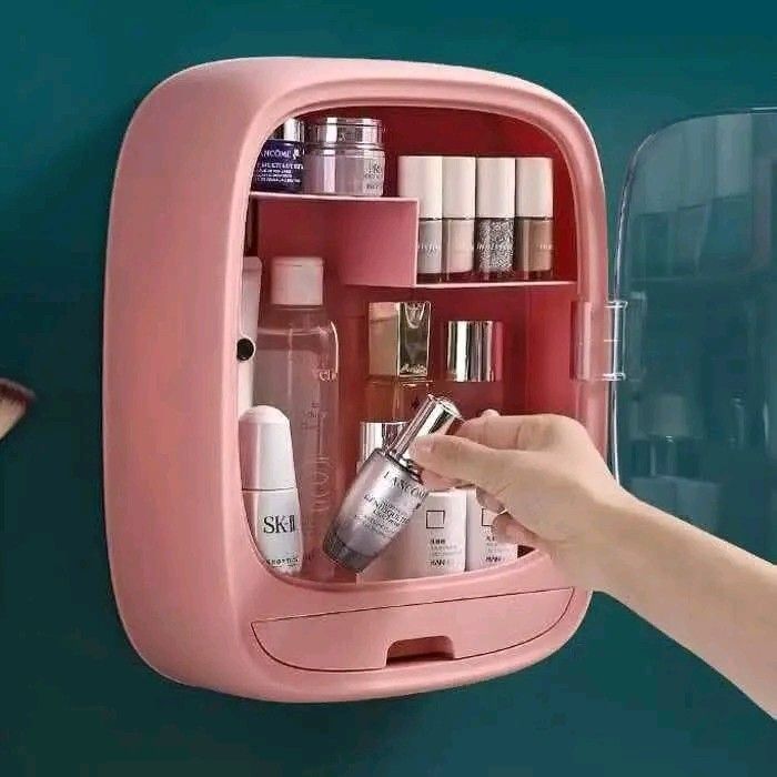 Wall-Mounted Cosmetic Organizer (Category: Makeup) located in Manila. Submitted by legitseller_angel06 (Listing ID 1425857971, Image 3). Description: Wall-mounted cosmetic organizer features multiple compartments and a drawer for storing various beauty products. It has a clear door for easy visibility and protection. The organizer is available in pink and blue. It is designed to save space and keep your cosmetics neatly organized. Dimensions are 