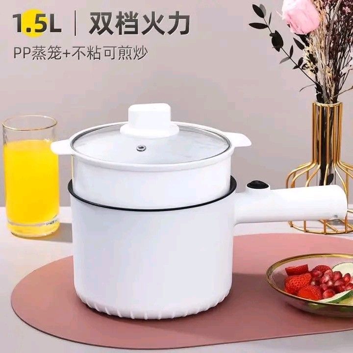 1.5L Multifunction Electric Cooker with Steamer (Category: Cookers) located in Manila. Submitted by legitseller_angel06 (Listing ID 1426034355, Image 1). Description: 1.5L electric cooker is perfect for steaming and cooking. It features a non-stick inner pot and a steamer basket. It has dual power settings and a glass lid. The cooker is white with a black interior. It's ideal for small meals and easy to clean..