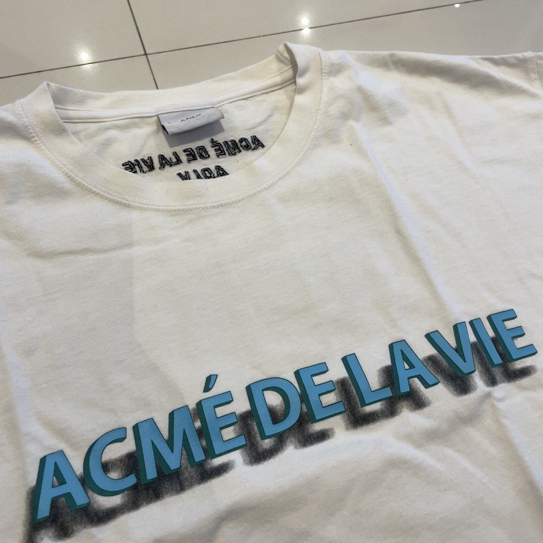ACME DE LA VIE Tshirt (ADLV) (Category: Tshirts & Polo Shirts ) located in Binan City. Submitted by vintagedrops (Listing ID 1426025663, Image 2). Description: 26x24 dimensions Excellent condition Authentic Med to large sizing 9.5 color rate 880 plus sf only .