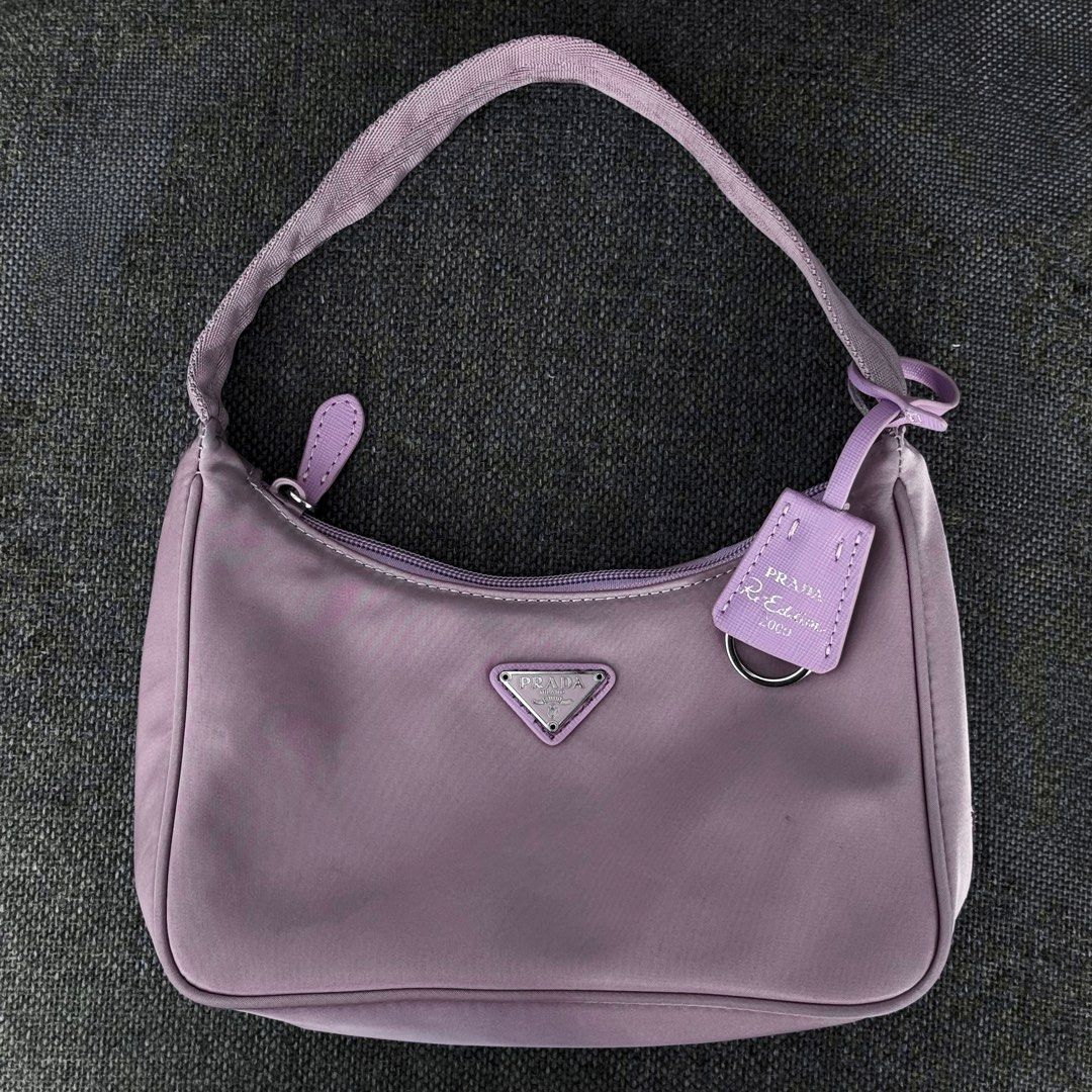 Authentic Prada Tessuto Purple Re-Edition 2005 Nylon Mini Bag (Category: Luxury Bags & Wallets) located in Quezon City. Submitted by lexi.cloud (Listing ID 1426097270, Image 1). Description: SUPER STEAL! ⚜️ guaranteed authentic ⚜️ personal preloved ⚜️ rare color ⚜️ guaranteed authentic ⚜️ minimal signs of usage, barely used ⚜️ 10/10 excellent condition ⚜️ bought from 🇯🇵 ⚜️ no inclusion note: color may vary due to lighting rfs: decluttering MONE
