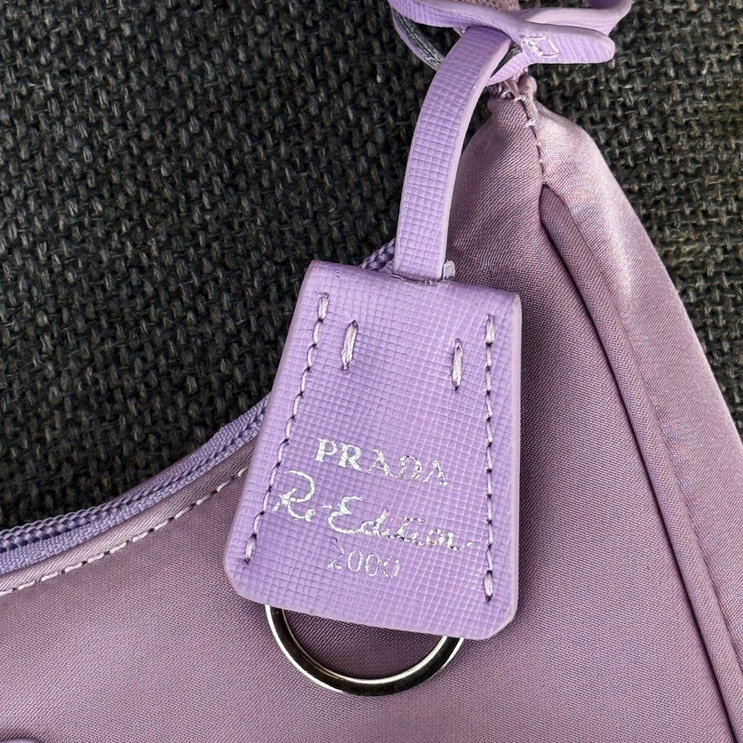 Authentic Prada Tessuto Purple Re-Edition 2005 Nylon Mini Bag (Category: Luxury Bags & Wallets) located in Quezon City. Submitted by lexi.cloud (Listing ID 1426097270, Image 3). Description: SUPER STEAL! ⚜️ guaranteed authentic ⚜️ personal preloved ⚜️ rare color ⚜️ guaranteed authentic ⚜️ minimal signs of usage, barely used ⚜️ 10/10 excellent condition ⚜️ bought from 🇯🇵 ⚜️ no inclusion note: color may vary due to lighting rfs: decluttering MONE