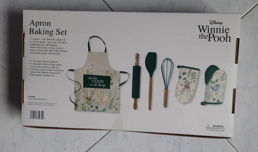 Baking Set (Category: Bathroom & Kitchen Fixtures) located in Singapore. Submitted by acer1958 (Listing ID 1426095255, Image 2). Description: - Winnie the Pooh Apron Baking Set - Includes: - Apron - Oven mitts - Spatula - Whisk - Rolling pin - Pot holder - Features a charming Winnie the Pooh design - Perfect for baking or as a gift.