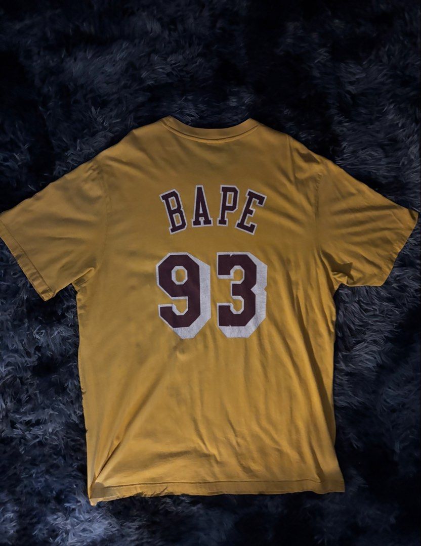 BAPE x Mitchell & Ness Lakers T-shirt (Category: Tshirts & Polo Shirts ) located in Cavite. Submitted by 222.cin (Listing ID 1426181173, Image 2). Description: Size L on tag 24.5x31 Like New NO ISSUE.