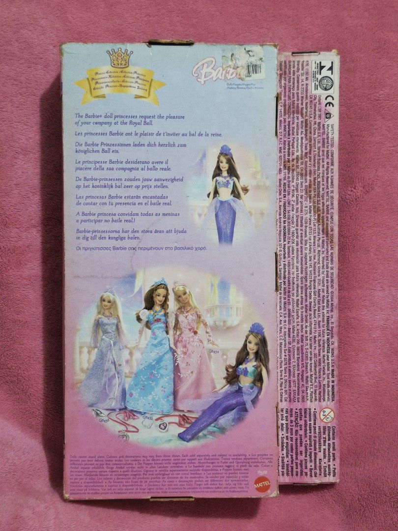 NRFB Barbie Mermaid Princess 2004 (Category: Kids Toys) located in Las Pinas. Submitted by peacock.treasures (Listing ID 1426087647, Image 2). Description: Barbie Mermaid Princess doll comes with accessories. The doll is wearing a mermaid-style outfit with a blue and purple color scheme. The box includes bonus accessories such as necklaces, rings, and a comb. The packaging features images of other Barbie dolls. The doll is suitable for ages 3 and
