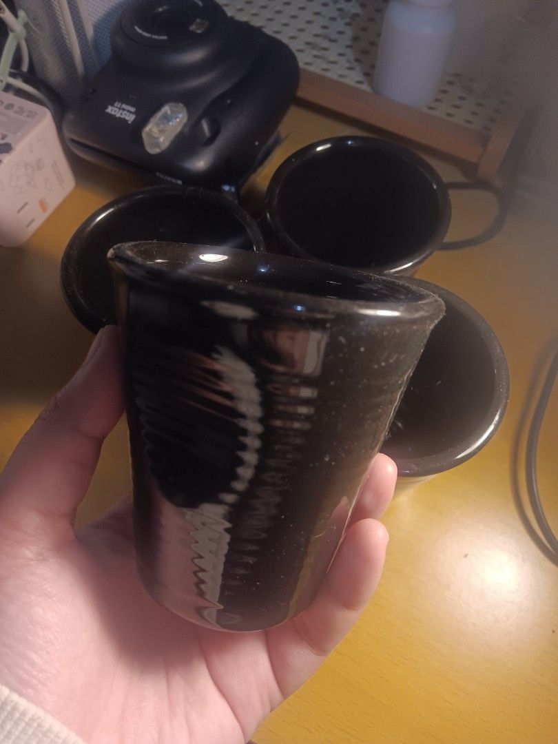 Black "Plastic" Ceramic Cups Set (Category: Coffee & Tea Tableware) located in Muntinlupa City. Submitted by hey_la (Listing ID 1426160937, Image 1). Description: Set of 4 black ceramic cups with glossy finish. Looks like plastic cups, but it's ceramic..