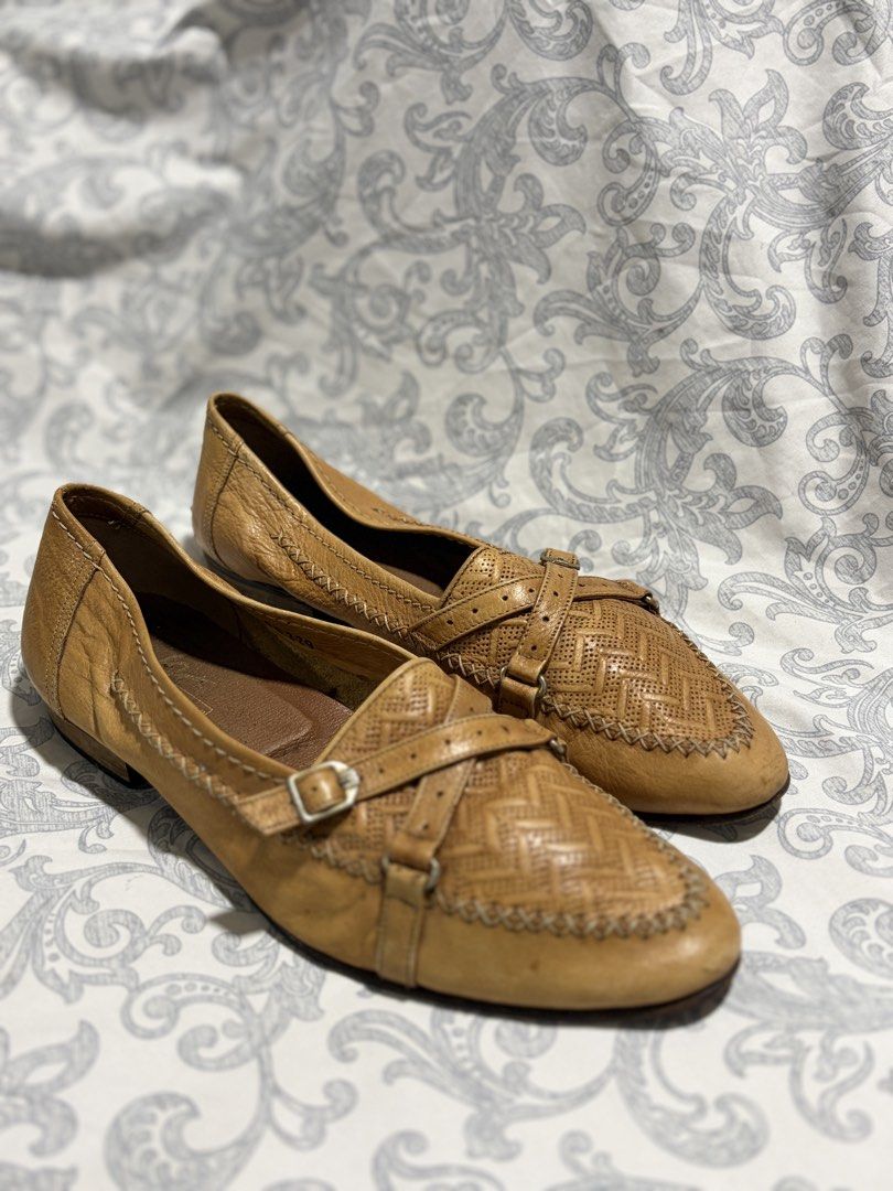Bruno Magli Leather Loafers (Category: Dress Shoes) located in Pili. Submitted by readysetthrift (Listing ID 1426115427, Image 1). Description: Genuine leather loafers by Bruno Magli. Features a woven design on the front with buckle details. Made in Italy. The shoes have a tan color. The interior shows some wear as well..