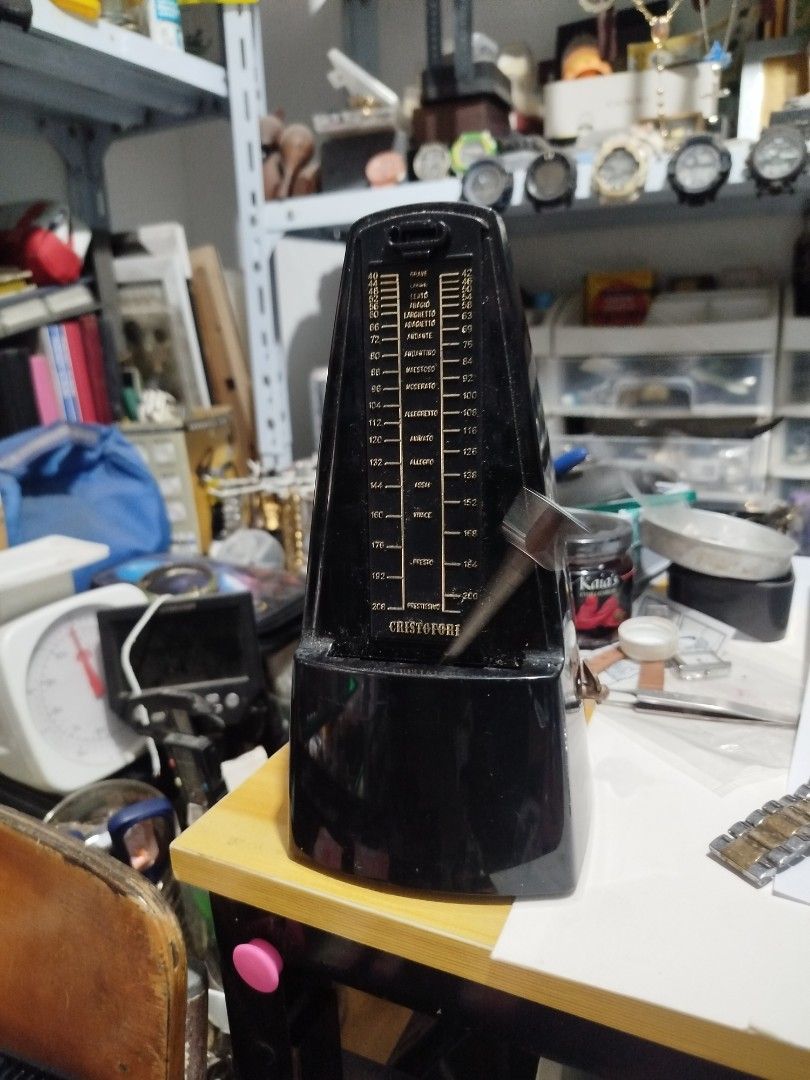 Christofori Metronome (Category: Musical Instruments) located in Subic. Submitted by regiedaniel01 (Listing ID 1426021912, Image 1). Description: Black Wittner metronome. It has a pendulum and a scale to adjust the tempo. The metronome is sitting on a wooden surface. The brand name is visible on the front of the metronome..