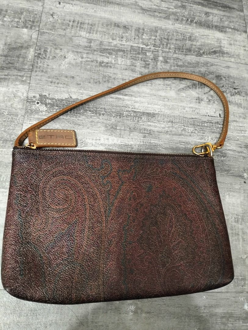 Etro Paisley Clutch (Category: Luxury Bags & Wallets) located in Batangas. Submitted by selahs-closet (Listing ID 1426134486, Image 1). Description: Etro clutch features a brown paisley pattern. It has a wrist strap and a gold-tone zipper. The clutch includes a small leather tag with the brand name..