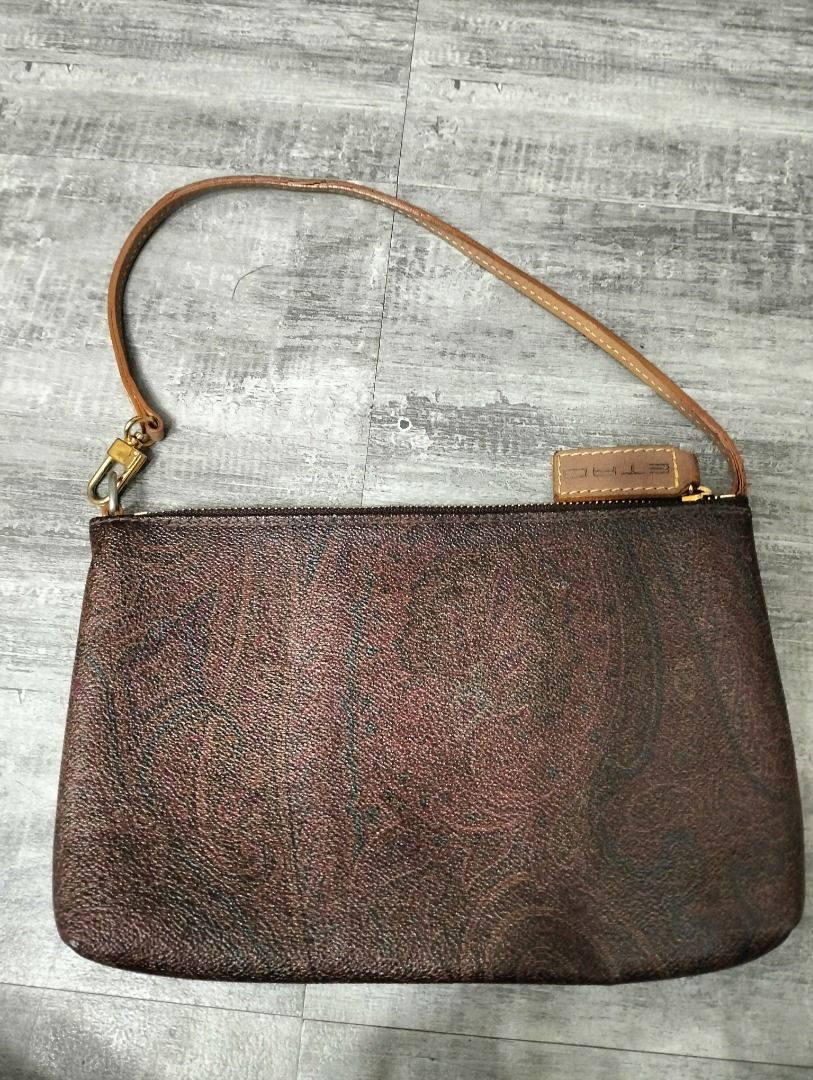 Etro Paisley Clutch (Category: Luxury Bags & Wallets) located in Batangas. Submitted by selahs-closet (Listing ID 1426134486, Image 2). Description: Etro clutch features a brown paisley pattern. It has a wrist strap and a gold-tone zipper. The clutch includes a small leather tag with the brand name..