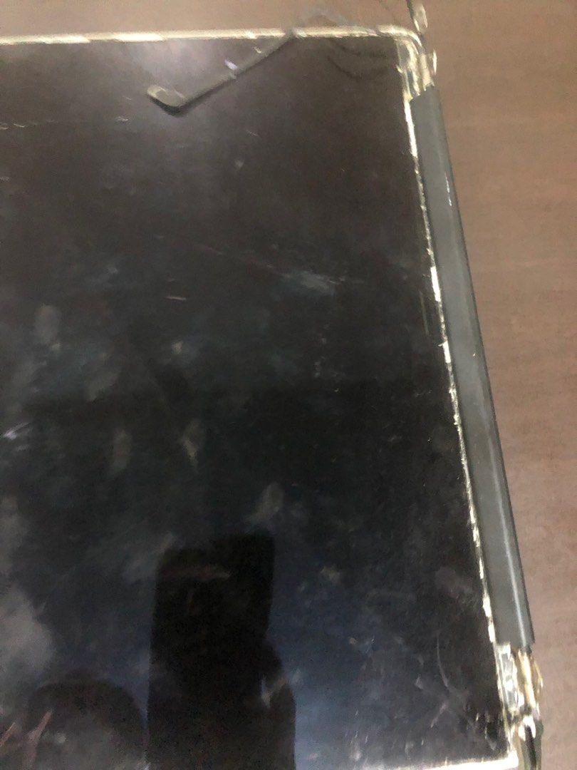 For parts Laptop Screen A1502 (Category: Laptops & Notebooks) located in Pasig City. Submitted by maxscollections (Listing ID 1426152147, Image 2). Description: - Cracked and damaged laptop screen - Visible hinge damage - Screen partially detached from frame - Scratches present - Sold as is Wires can be used as told.