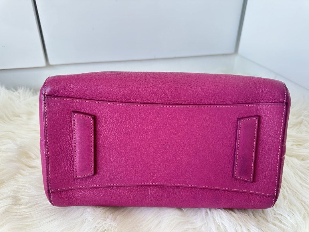 Givenchy Antigona Medium Handbag (Category: Luxury Bags & Wallets) located in Cabanatuan. Submitted by matetqqq (Listing ID 1426098105, Image 3). Description: Authentic Givenchy Antigona medium handbag in a vibrant pink color. Features a top handle and a detachable shoulder strap. The bag has a zip closure and silver-tone hardware. The Givenchy logo is visible on the front. Made in Italy..