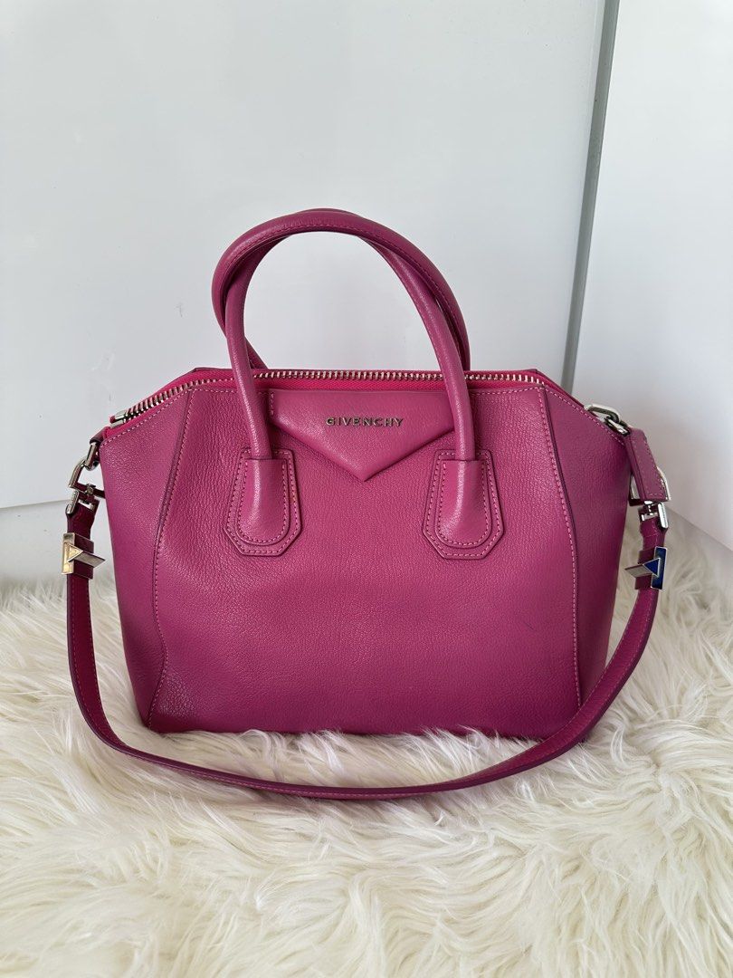 Givenchy Antigona Medium Handbag (Category: Luxury Bags & Wallets) located in Cabanatuan. Submitted by matetqqq (Listing ID 1426098105, Image 1). Description: Authentic Givenchy Antigona medium handbag in a vibrant pink color. Features a top handle and a detachable shoulder strap. The bag has a zip closure and silver-tone hardware. The Givenchy logo is visible on the front. Made in Italy..