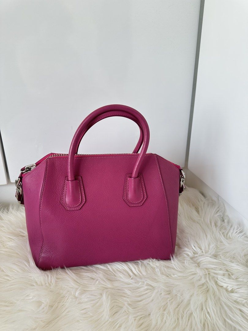 Givenchy Antigona Medium Handbag (Category: Luxury Bags & Wallets) located in Cabanatuan. Submitted by matetqqq (Listing ID 1426098105, Image 2). Description: Authentic Givenchy Antigona medium handbag in a vibrant pink color. Features a top handle and a detachable shoulder strap. The bag has a zip closure and silver-tone hardware. The Givenchy logo is visible on the front. Made in Italy..