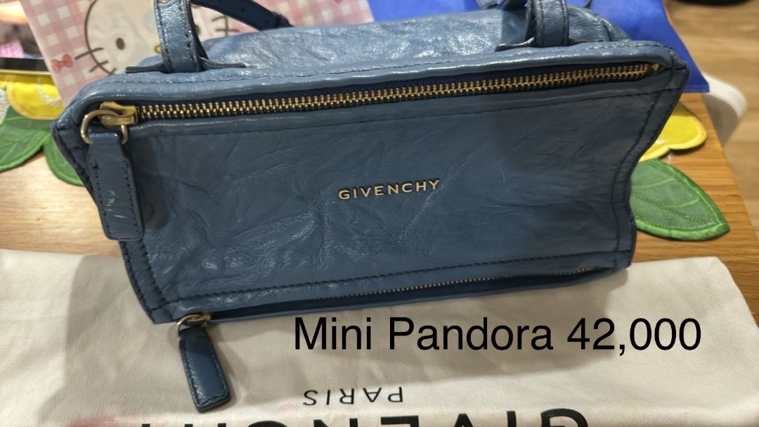 Givenchy Mini Pandora Bag (Category: Luxury Bags & Wallets) located in Manila. Submitted by mylittlebubu (Listing ID 1426009401, Image 1). Description: Authentic Givenchy Mini Pandora bag in a beautiful blue color. Features a cross body strap and a zip closure. The bag has the Givenchy logo on the front.A stylish and compact bag perfect for everyday use..
