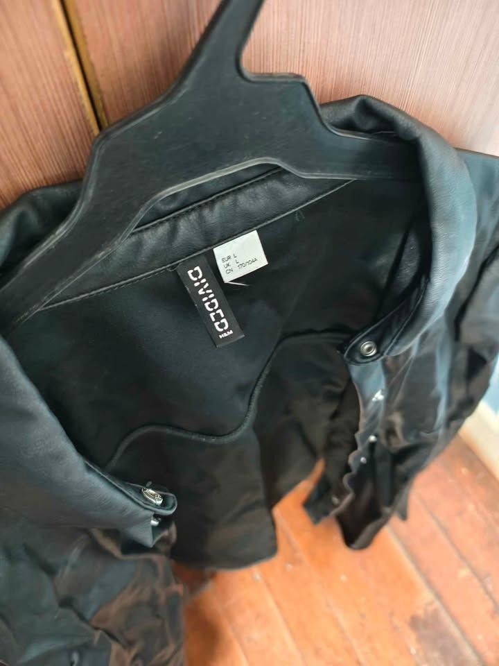 H&M Divided Black Faux Leather Jacket (Category: Coats, Jackets and Outerwear) located in Cebu City. Submitted by jacsitems (Listing ID 1426090613, Image 2). Description: H&M faux leather jacket Size L women shoulder width 36cm/14in Torso length 56cm/22in Sleeve length 61cm/24in Waist/torso width 112cm/44in.
