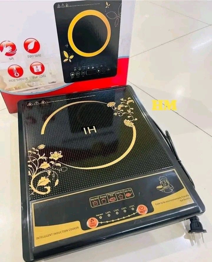Induction Cooker (Category: Cookers) located in Manila. Submitted by legitseller_angel06 (Listing ID 1426036657, Image 1). Description: Induction cooker features a sleek black design with gold accents. It has multiple cooking settings, including options for hot pot, soup, and frying. The cooker includes a digital display and a power cord. The box indicates it is an "Intelligent Induction Cooker"..