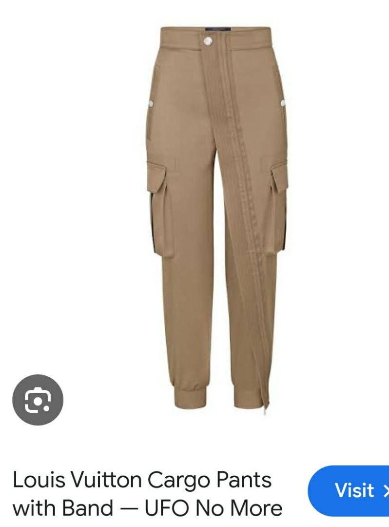 Louis Vuitton Black Cargo Pants diagonal full zip (Category: Luxury Apparel) located in Santo Tomas. Submitted by pickers_corner (Listing ID 1426048037, Image 2). Description: womens cargo pants diagonal full zip missing main brand tag size 40 on tag w28 L34 excellent color rate no holes no stain Black cargo pants from Louis Vuitton. Features multiple pockets and zippers at the ankles. The pants have the Louis Vuitton logo on the buttons and zipp