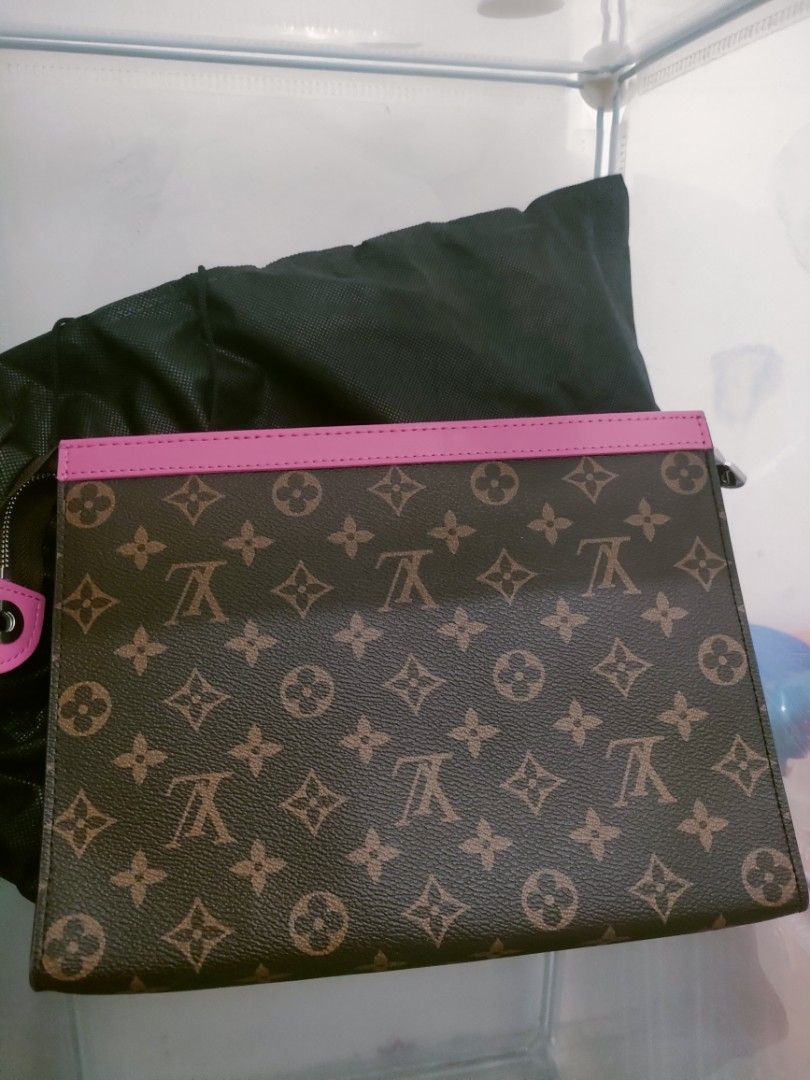 Louis Vuitton Clutch with Pink Trim (Category: Luxury Bags & Wallets) located in Cavite. Submitted by red_2407 (Listing ID 1426181883, Image 1). Description: Stylish Louis Vuitton clutch featuring the iconic monogram pattern. It has a vibrant pink trim and a matching interior. The clutch includes multiple card slots for organization. It has a zipper closure to secure your belongings. Comes with a dust bag..