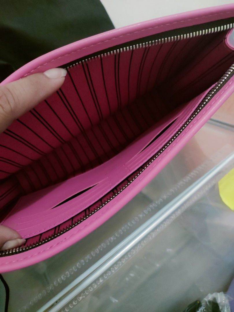 Louis Vuitton Clutch with Pink Trim (Category: Luxury Bags & Wallets) located in Cavite. Submitted by red_2407 (Listing ID 1426181883, Image 3). Description: Stylish Louis Vuitton clutch featuring the iconic monogram pattern. It has a vibrant pink trim and a matching interior. The clutch includes multiple card slots for organization. It has a zipper closure to secure your belongings. Comes with a dust bag..