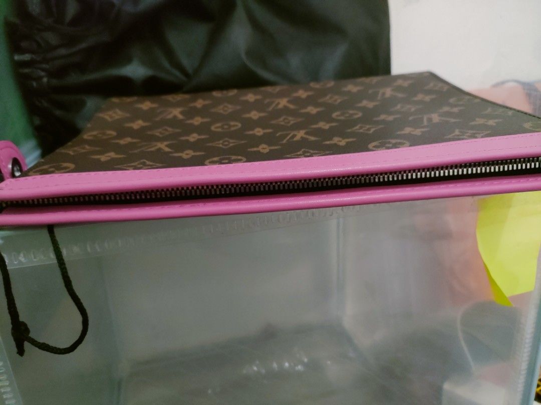Louis Vuitton Clutch with Pink Trim (Category: Luxury Bags & Wallets) located in Cavite. Submitted by red_2407 (Listing ID 1426181883, Image 2). Description: Stylish Louis Vuitton clutch featuring the iconic monogram pattern. It has a vibrant pink trim and a matching interior. The clutch includes multiple card slots for organization. It has a zipper closure to secure your belongings. Comes with a dust bag..