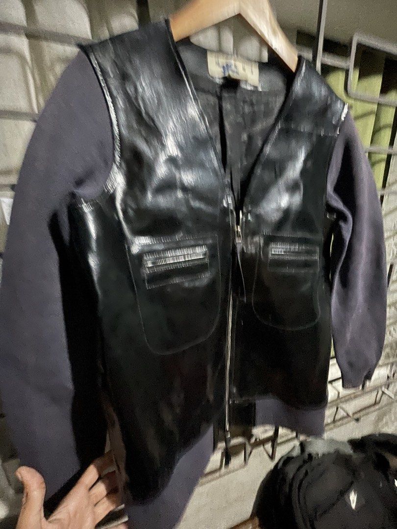 MARNI Leather Jacket (Category: Luxury Apparel) located in Aloran. Submitted by dirtycash777 (Listing ID 1426154609, Image 2). Description: Stylish MARNI jacket with a unique design. Features a black leather front and sleeves with a contrasting dark grey fabric. It has a zip closure, two front pockets, and a comfortable lining. The jacket has a classic V-neck design. The label indicates it is a size 4. Sizes:inches* Waist:19 Length:26 Sleeve:24 I