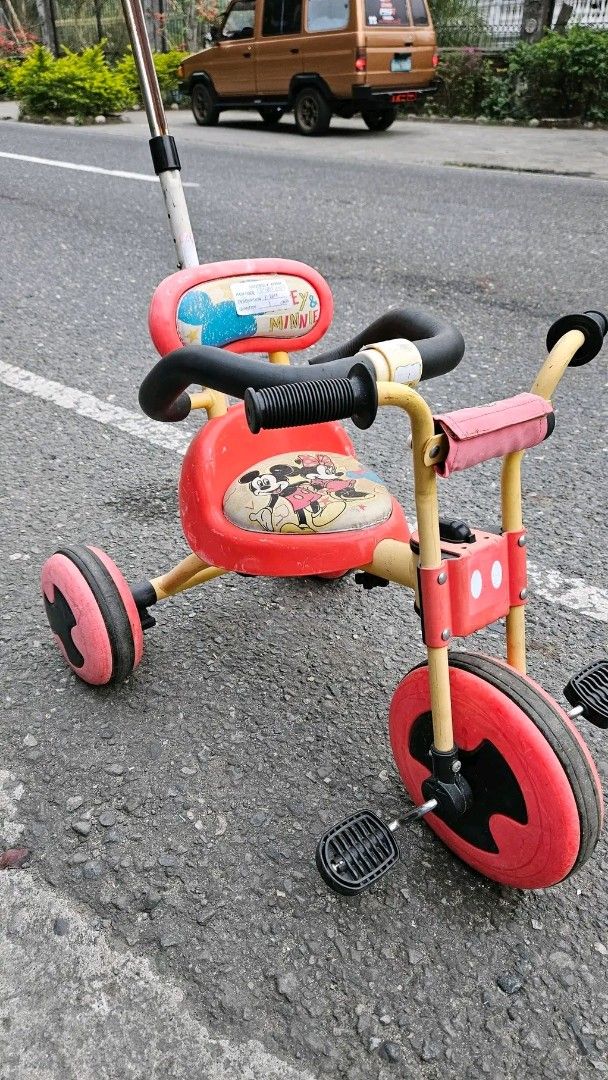 Mickey Mouse Tricycle with Push Handle (Category: Babies & Kids Fashion) located in Sablan. Submitted by gongonshelley12 (Listing ID 1426014141, Image 2). Description: FIRST TO PAY, FIX PRICE 1500 ONLY!!! SUPER SALE!!! GCASH NOW JAPAN DISNEY MICKEY MOUSE TRICYCLE WITH SAFETY BAR AND CONTROL BAR SUITABLE UP TO 5 YRS OLD JAPAN SURPLUS MAHAL NG ORIG PRICE NITO 5000+, LAKI NG NATIPID NIYO MAKAPAL MGA GULONG, PUNASAN NIYO LANG MAGANDA PA ITO MATAGAL M