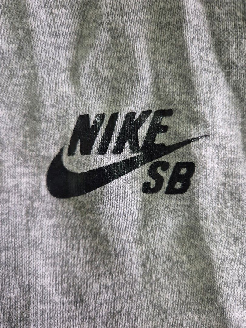 Nike SB Zip-Up Hoodie (Category: Hoodies) located in Manila. Submitted by rochrens (Listing ID 1426025155, Image 2). Description: Gray Nike SB zip-up hoodie. Features a hood with drawstrings and a Nike SB logo on the chest. Includes two front pockets. From the athletic dept Unisex Fits small to med Men Fits Large to Women.