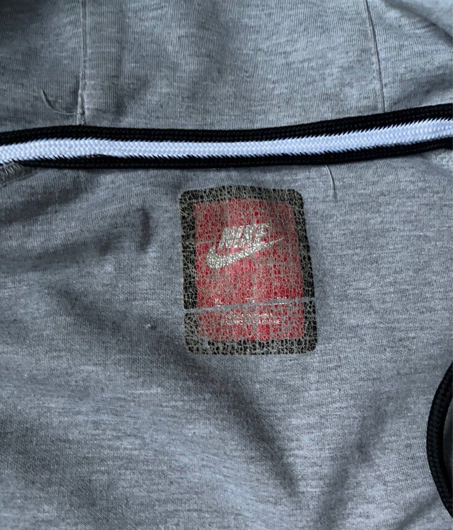Nike Tech Fleece Hoodie (Category: Coats, Jackets and Outerwear) located in Quezon City. Submitted by infapparel (Listing ID 1426106461, Image 2). Description: (Second hand) Brand: Nike Size: Xl Issues: Broken Zipper/Hindi siya ma zipper Please check the photo to see the exact condition and look of the shirt.
