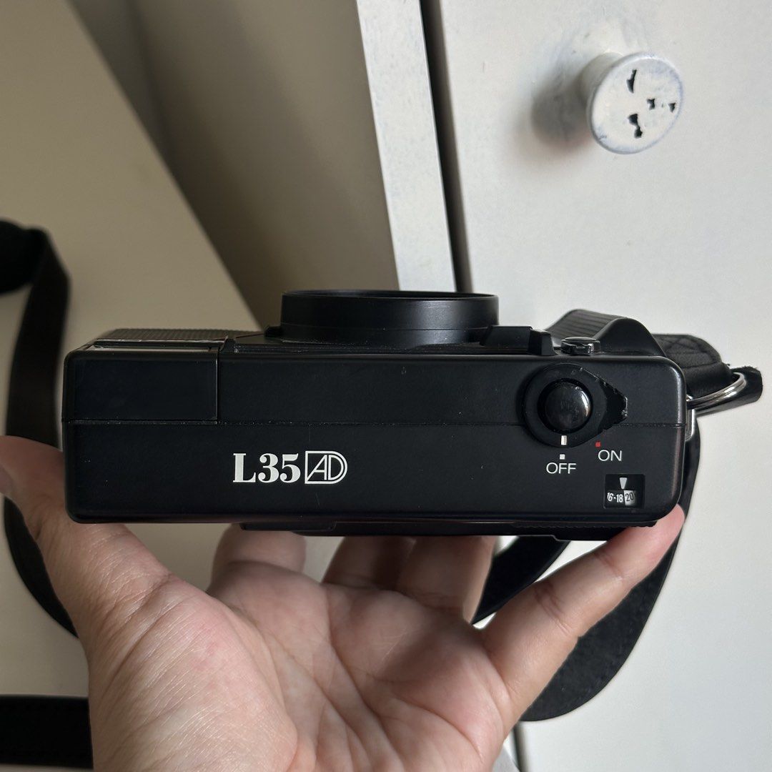 Nikon L35AD 35mm Film Camera (Category: Cameras) located in Calamba. Submitted by alyssuhks (Listing ID 1426108947, Image 3). Description: Nikon L35AD Premium 35mm point and shoot camera with date function Features: - Shoots with 35mm f/2.8 prime autofocus lens - Date imprint feature - Self timer - Controllable flash - Adjustable ISO - Flash ready indicator - With film inside the camera - +Free Unopened Film (Cinestill 800Tungsten).
