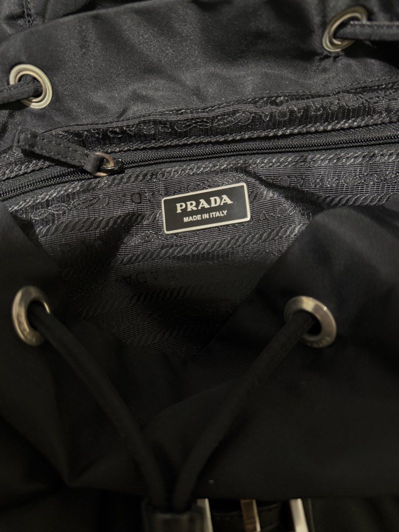 Prada (Category: Luxury Bags & Wallets) located in Pasig City. Submitted by reyeslarry11740 (Listing ID 1426085896, Image 3). Description: For Sale Prada Black Tessuto Nylon Zainetto Small Backpack Bag Legit💯 Black Dims 13.2w x 14.5L Very good condition Walang gasgas tela Issue normal sign of usage sa leather see last 3 pictures, may konting kalawang handle zip 13k plus ship only no lp Payment 1st Pasig city.