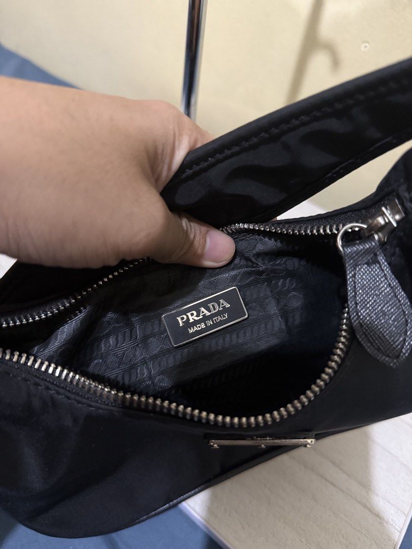 Prada Nylon Bag (Category: Luxury Bags & Wallets) located in Cagayan de Oro. Submitted by twice.but.nice.blackmarket (Listing ID 1426154762, Image 3). Description: - Excellent condition - Made in Italy on emblem logo - Color rate 9.5 - Height 6 - Width 9 What u see is what u get!.