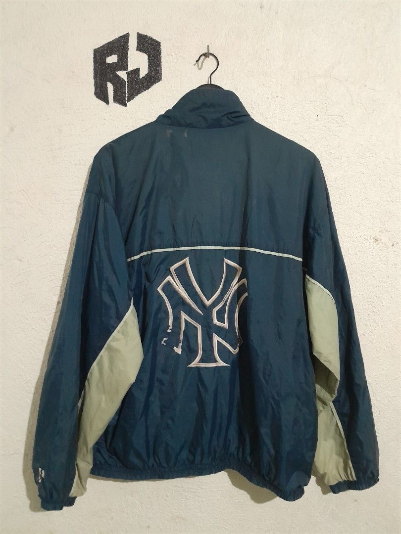 Pro Player MLB New York Yankees Jacket 24/28 (Category: Coats, Jackets and Outerwear) located in Manila. Submitted by kuyanyo (Listing ID 1426115869, Image 2). Description: Authentic Pro Player jacket featuring the New York Yankees logo. It has a navy blue and light gray color scheme with a mesh design. The jacket is a medium size and made in Guatemala. It has a full zip closure and the Yankees logo is prominently displayed on the front and back.