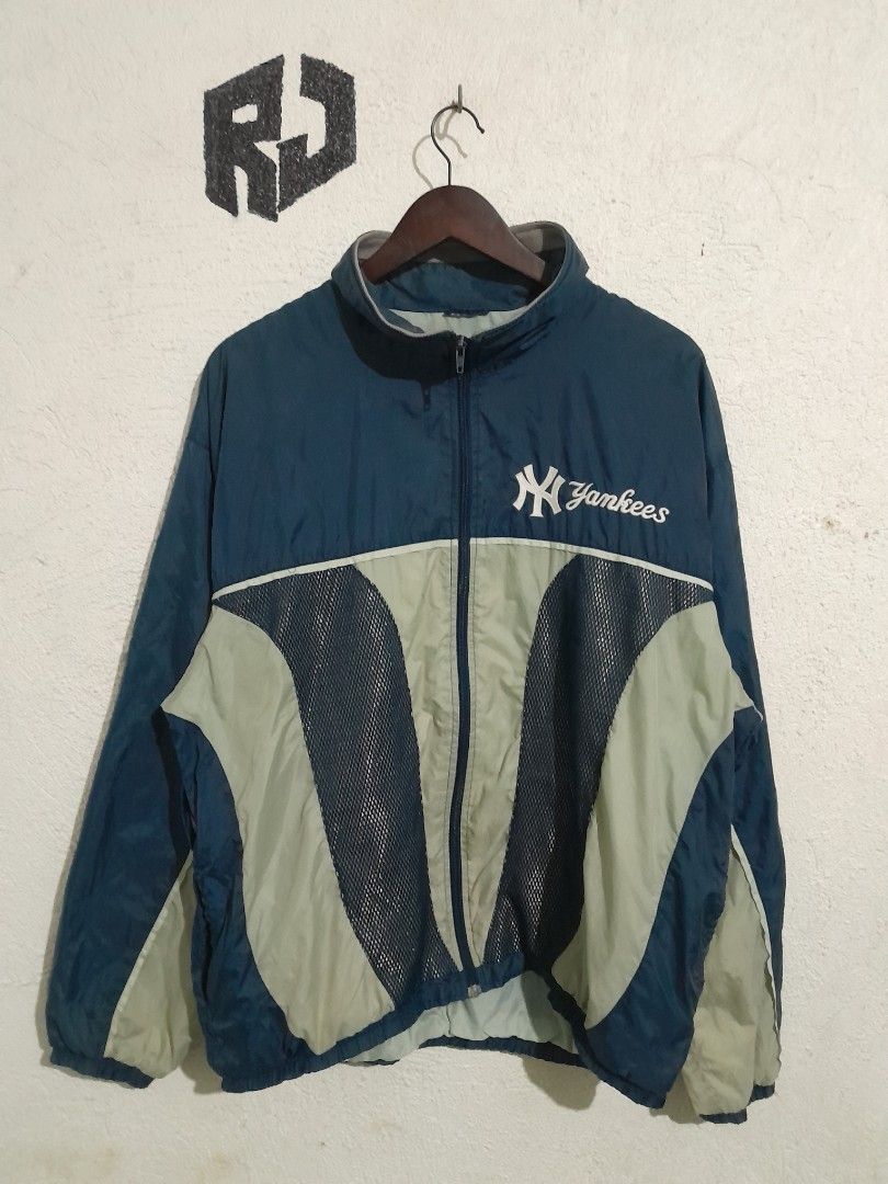 Pro Player MLB New York Yankees Jacket 24/28 (Category: Coats, Jackets and Outerwear) located in Manila. Submitted by kuyanyo (Listing ID 1426115869, Image 1). Description: Authentic Pro Player jacket featuring the New York Yankees logo. It has a navy blue and light gray color scheme with a mesh design. The jacket is a medium size and made in Guatemala. It has a full zip closure and the Yankees logo is prominently displayed on the front and back.