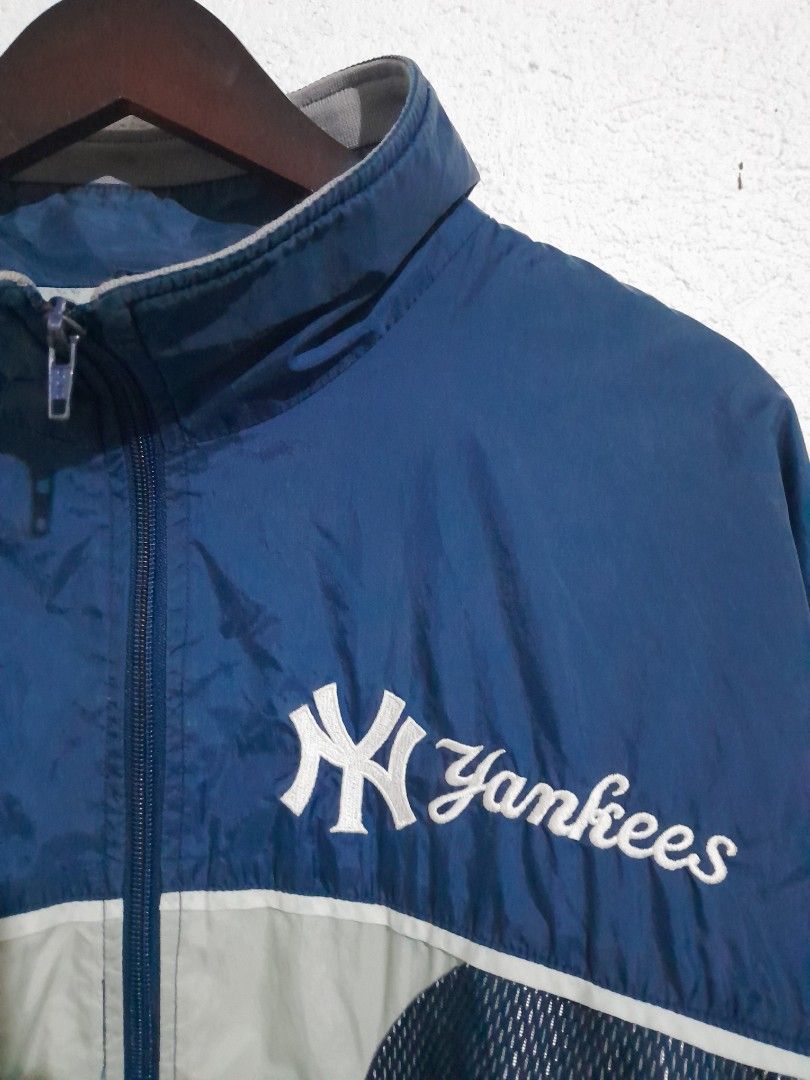 Pro Player MLB New York Yankees Jacket 24/28 (Category: Coats, Jackets and Outerwear) located in Manila. Submitted by kuyanyo (Listing ID 1426115869, Image 3). Description: Authentic Pro Player jacket featuring the New York Yankees logo. It has a navy blue and light gray color scheme with a mesh design. The jacket is a medium size and made in Guatemala. It has a full zip closure and the Yankees logo is prominently displayed on the front and back.