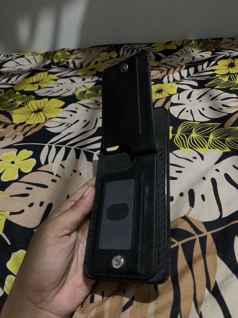 Realme Narzo 5i Wallet Phone Case - Black Textured Design (Category: Cases & Sleeves) located in San Juan, La Union. Submitted by declutteringog7 (Listing ID 1426147828, Image 3). Description: Practical wallet-style case for Realme Narzo 5i. Features a textured exterior, zippered pocket for cash/coins, and a card slot with a clear ID window. All parts work perfectly – no tears, scratches, or broken zippers. Great for keeping essentials in one pla