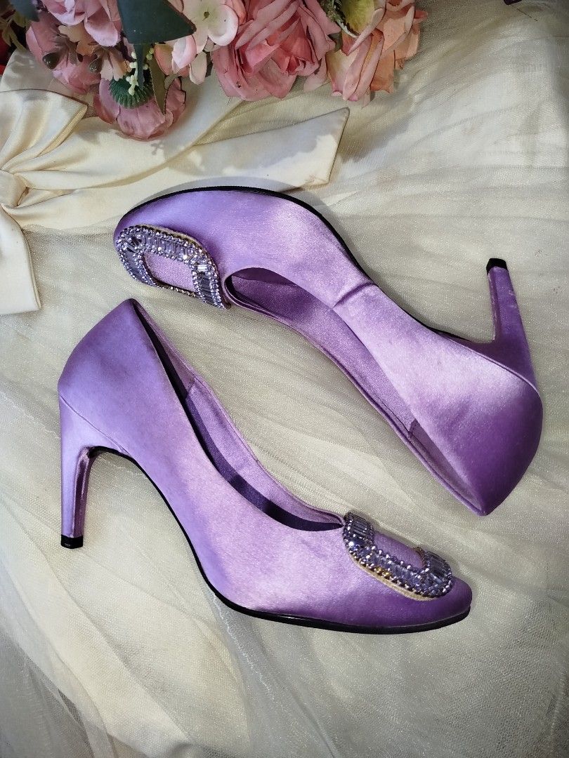 Roger Vivier Purple Satin Heels (Category: Sneakers & Footwear) located in San Fernando. Submitted by la_segunda2727 (Listing ID 1426105606, Image 2). Description: Elegant RV heels in a beautiful purple satin. Features a sparkling rectangular buckle detail. The heels have a semi- pointed toe and a slender heel. The soles indicate a size 38. Perfect for special occasions or adding a touch of glamour to any outfit..