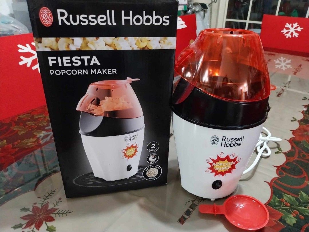 Russell Hobbs Fiesta Popcorn Maker (Category: Other Kitchen Appliances) located in Pasig City. Submitted by rare.ashima25 (Listing ID 1426121903, Image 1). Description: Make delicious popcorn at home with this Russell Hobbs Fiesta Popcorn Maker. It features a white and black design with an orange top. Includes a measuring spoon. Perfect for movie nights or a quick snack. Easy to use and clean..