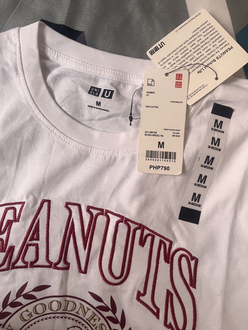 Uniqlo Peanuts Graphic T-Shirt - Medium (Category: Shirts) located in San Fernando. Submitted by greatnesshe (Listing ID 1426086882, Image 3). Description: Uniqlo Peanuts graphic t-shirt in white. Features a Snoopy design with the word "PEANUTS" in maroon. Made of 100% cotton. Size is Medium. Brand new with tags..
