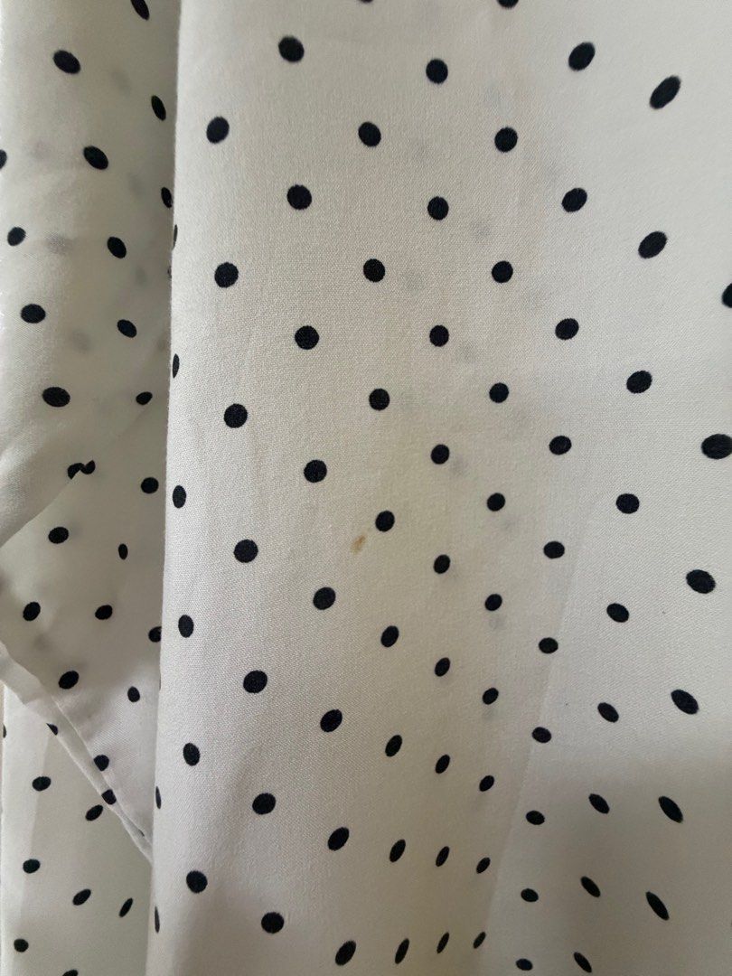Uniqlo Polka Dot Shirt (Category: Shirts) located in Manila. Submitted by dencarmd (Listing ID 1426025584, Image 3). Description: White shirt with black polka dots from Uniqlo. Features a button-down front and long sleeves. The shirt has a classic collar and is size S. There are some stains on the front of the shirt..