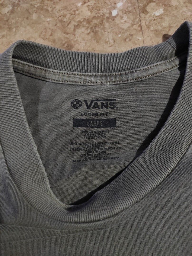 Vans Made For The Elements Loose Fit T-Shirt (Category: Tshirts & Polo Shirts ) located in Las Pinas. Submitted by jeusmanlangit (Listing ID 1426110293, Image 3). Description: VANS MADE FOR THE ELEMENTS LOOSE FIT -Vans t-shirt features a mountain graphic on the back and a small logo on the front. -It is a loose fit, size large. -The shirt is a muted green color. -The tag indicates it is made of organic cotton. -The Vans logo is also visible on th