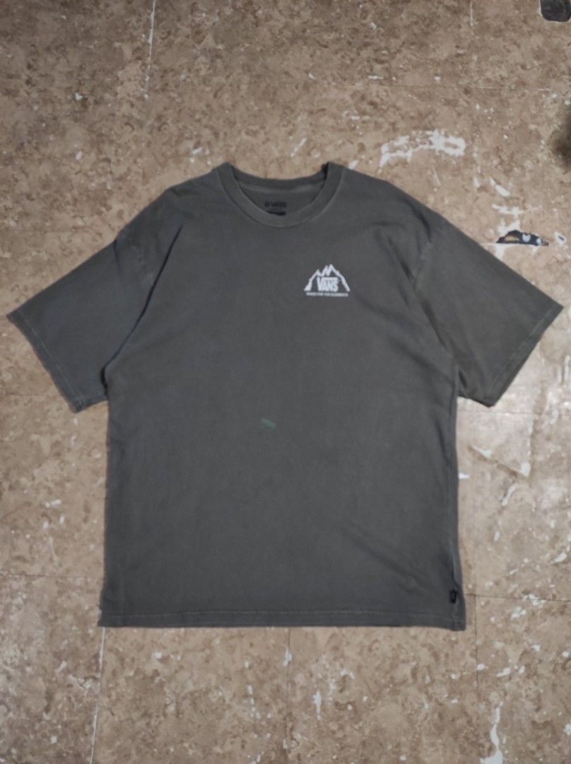 Vans Made For The Elements Loose Fit T-Shirt (Category: Tshirts & Polo Shirts ) located in Las Pinas. Submitted by jeusmanlangit (Listing ID 1426110293, Image 1). Description: VANS MADE FOR THE ELEMENTS LOOSE FIT -Vans t-shirt features a mountain graphic on the back and a small logo on the front. -It is a loose fit, size large. -The shirt is a muted green color. -The tag indicates it is made of organic cotton. -The Vans logo is also visible on th