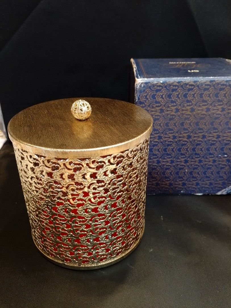 Vintage Max Factor Cosmetic Gold Container with Box (Category: Makeup) located in Binangonan. Submitted by stufflikedat (Listing ID 1426101108, Image 1). Description: Vintage Max Factor (US} gold-toned filigree decorative all metal container with a lid cover, red felt base interior and original box often styled as trinket box, canister or vanity decor in shiny new old stock & unused condition approx 5"height x 5" diameter for 750 + shipping.