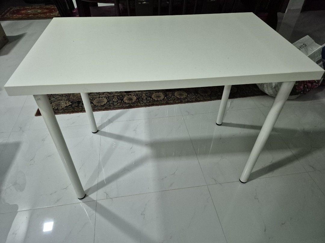 White Rectangular Table (Category: Tables & Sets) located in Singapore. Submitted by sky-786 (Listing ID 1426142231, Image 1). Description: Simple white rectangular table. Suitable for various uses. Sturdy legs provide good support. Perfect for small spaces.ikea table. L1m x W60cm x H74cm delivery can be considered..