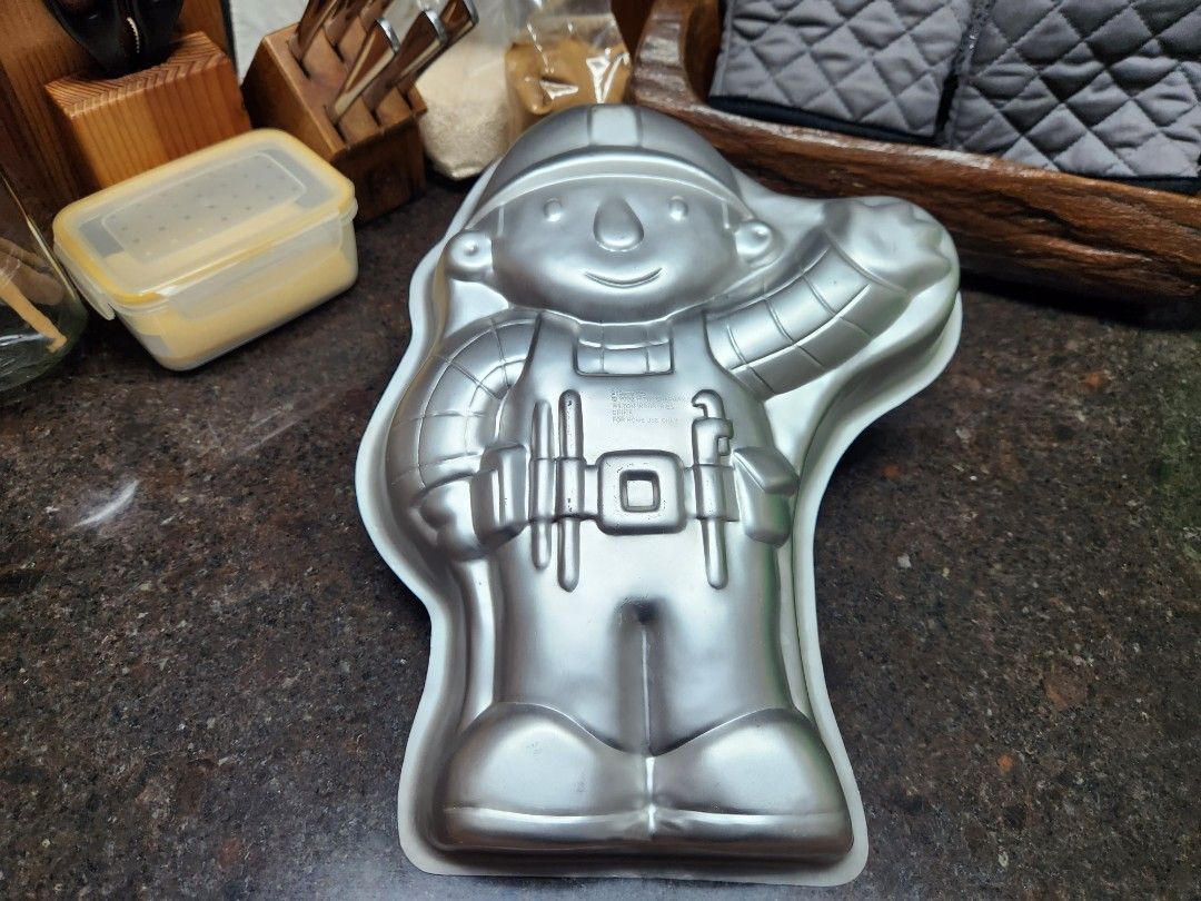 Wilton Bob the Builder-Themed Cake Pan (Category: Bakeware) located in Marikina City. Submitted by mutesolis (Listing ID 1426106758, Image 1). Description: Description: A cake pan that can be used to create a cake in the shape of the character, Bob the Builder. Reason for Selling: The pan is being sold because the original owner had lost interest in making cakes like these. Issues: The pan has a few scratches. Otherwise, there are no issues with 