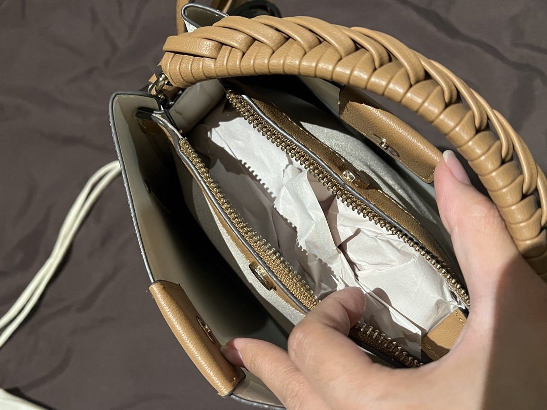 Aldo White Bucket Bag with Braided Handle (Category: Shoulder Bags) located in Paranaque City. Submitted by lois.ng (Listing ID 1426365215, Image 3). Description: Original Aldo Bucket Bag Dimensions: 25 Cm x 23 Cm x 14 Cm (H x L x W) Handle Drop Length: 4.00 In (10.16 Cm) Strap Drop Length: 23.00 In (58.42 Cm).